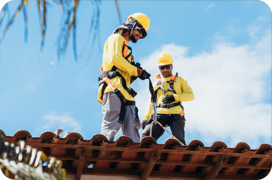 Roofing workers on a job site